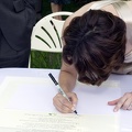 Bride Signs the Wedding Certificate