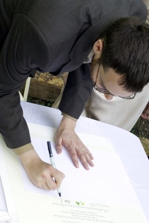 Groom Signs the Wedding Certificate