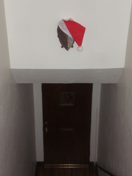We recently hung this mask on the wall above the stairs heading down to the front door. Now it's festive! flickr-ginsnob-3126318909.jpg
