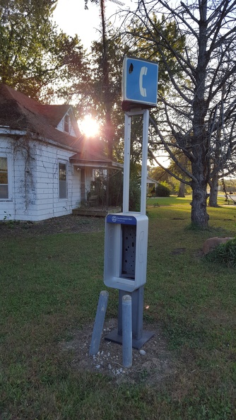 Stopped while riding to swap out sunglasses. Turned around and saw this in the middle of someone's yard. Who says there's no phone service in rural Kansas!
Bonus feature: bench on porch blocking those inside from getting out. This whole state is full of zombies. flickr-ginsnob-21933125558.jpg