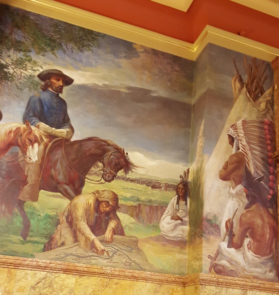 Caption: Col. John C. Fremont addressing Indians in Kansas Territory. Fremont, accompanied by his aides, experienced famine and hardships during his expeditions through the west. The art in the capitol building is big on themes of struggling white people and useless or violent Native Americans. 2015-11-14 11.19.10_crop.jpg