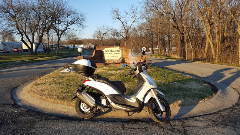 Scooter by Mobile Home sign