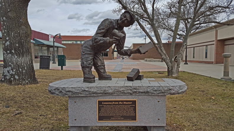 Lessons from the Master
William Deafy Boular is the very human embodiment of the Kansas motto, Ad Astra Per Aspera: To the Stars Through Difficulties. A champion bricklayer - once featured in Ripley's Believe It Or Not for laying 46,000 paving bricks in less than 8 hours - Boular overcame adversity to literally lay the foundation for those who came after him. An illness at 4-years-old left him deaf & unable to speak - then at age 10, hit by a train his legs were cut off below the knee. But he did not let his difficulties define him - becoming a productive & energetic worker known for his special boots and affectionately called Deafy by the people of Atchinson. 2016-02-07 13.11.32_deafy.jpg