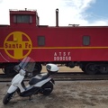 Scooter by a Caboose