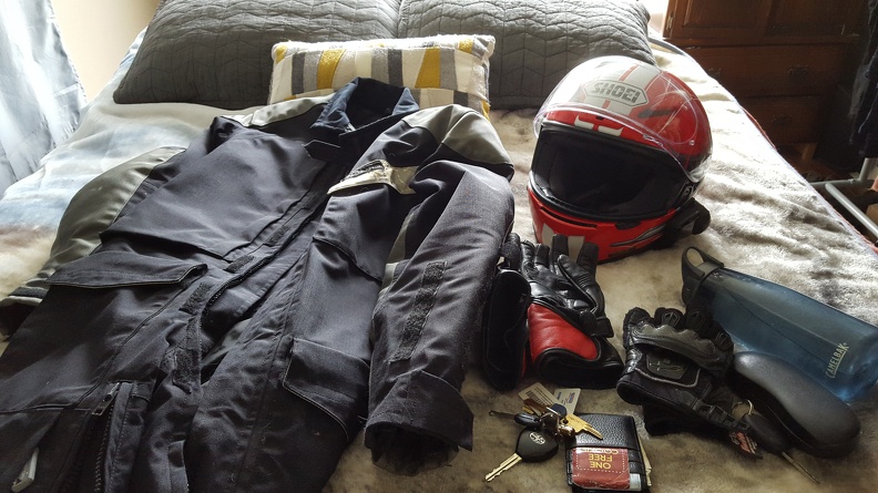 Gathering my gear for a 1.5 hour drive out and back (plus some exploration). Old roadcrafter suit (with extra armor installed), helmet, a couple of pairs of gloves (in case it's a lot warmer on the way back, which it was), etc.
For longer rides I'll swap out the water bottle with a camelbak. 2016-04-16 09.55.06.jpg