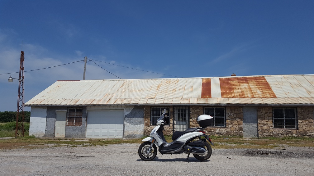 Scooter by Abandoned Tire Shop
