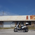 Scooter by Abandoned Tire Shop