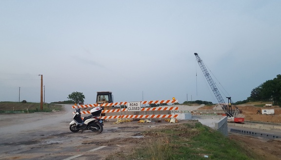 Scooter by Road Closed Sign