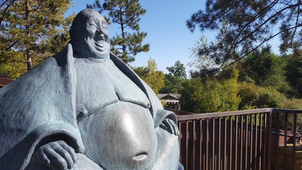 Rub his belly for luck!