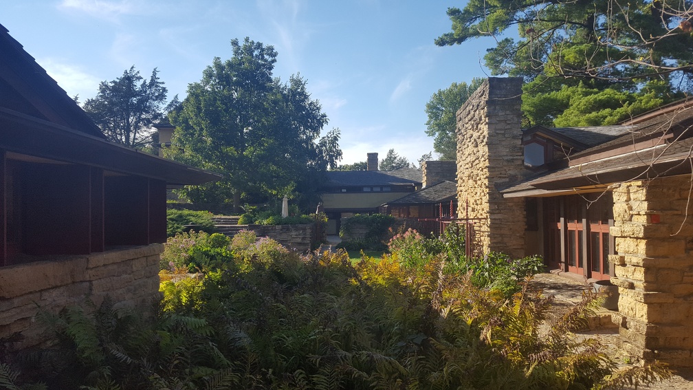 Taliesin Gardens. FLW had his office here (you can see his signature red square in the column on the right). The door to his obvious was a bit hard to find, he wanted his clients to wander in through the main entrance (a tight tunnel) and then be delighted to wander the gardens opening up before them before finally locating his door.