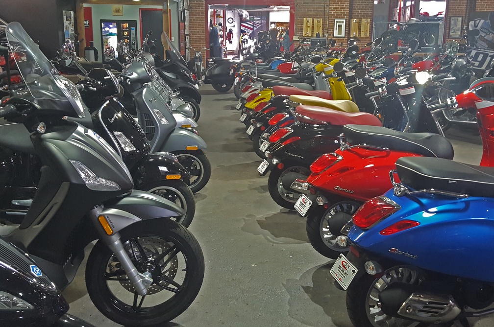 That's a fancy new BV350 in black on the left, and a row of colorful Vespas on the right.