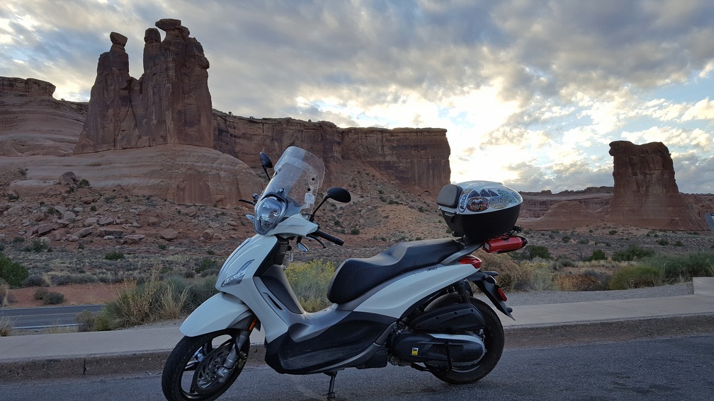 I'm totally a huge fan of this rock formation that looks a group of towering people and is visible from both sides. One of my favorite things to see on the way out of the park. I am also a fan of my scooter.