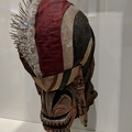"Mask with black markings over face"